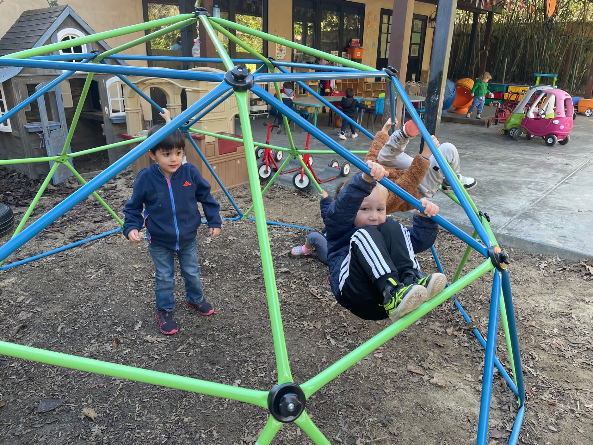 Children climbing the outdoor jungle gym