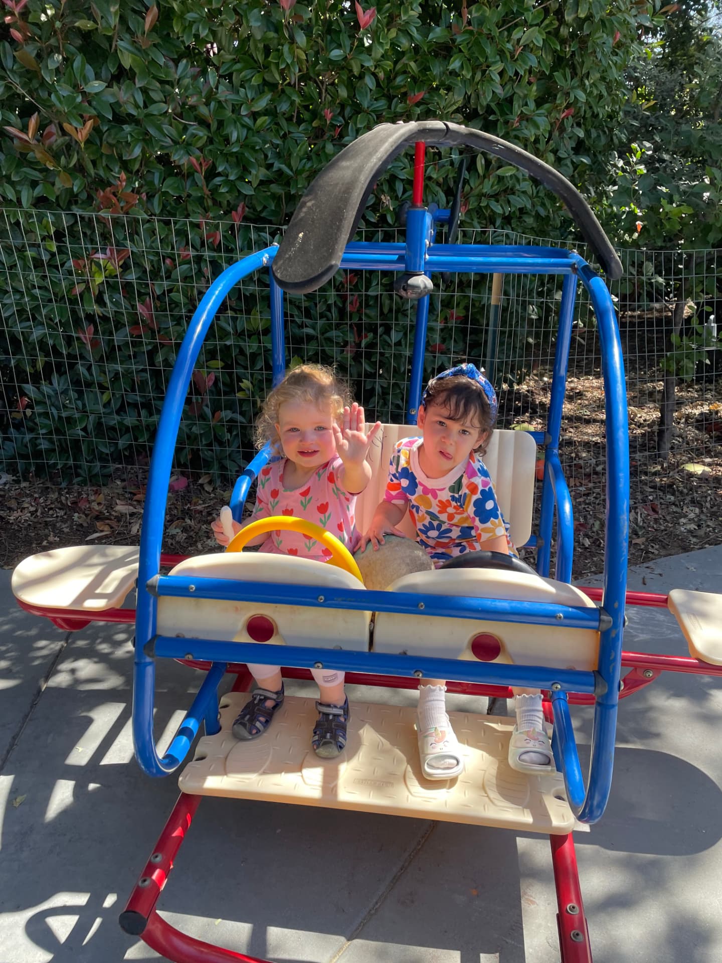 Children playing together on the playground helicopter