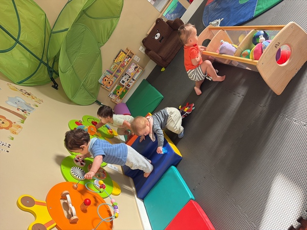 Infants exploring the indoor soft-play gym
