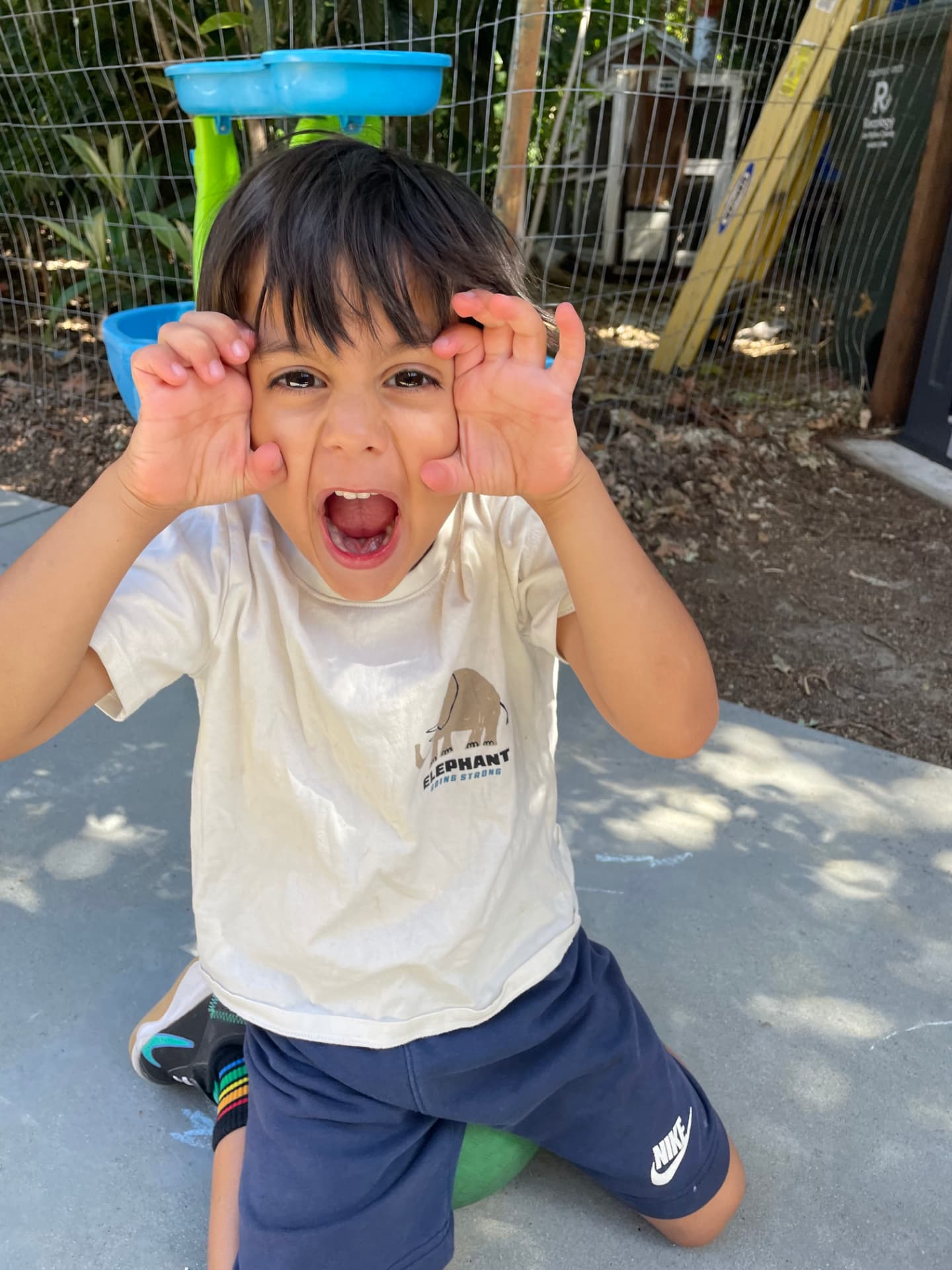 A child enjoying imaginative play outdoors
